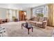 Warm and inviting living room with comfortable sofa and a sunny window view at 1229 N German Church Rd, Indianapolis, IN 46229