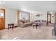 Inviting living room showcasing plush sofas, soft carpet, and lots of natural light at 1229 N German Church Rd, Indianapolis, IN 46229