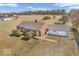 Aerial view of home with a large tree-lined lot, providing a sense of seclusion and natural beauty at 1229 N German Church Rd, Indianapolis, IN 46229