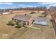Aerial view of home with a large tree-lined lot, providing a sense of seclusion and natural beauty at 1229 N German Church Rd, Indianapolis, IN 46229
