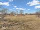 Beautiful property with a home nestled among trees and expansive lawns, offering privacy and tranquility at 1229 N German Church Rd, Indianapolis, IN 46229