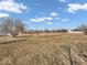Expansive property showcasing the home with large surrounding lawn, offering space and privacy at 1229 N German Church Rd, Indianapolis, IN 46229