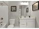 Bright bathroom featuring a shower-tub combo, white vanity, framed mirror and neutral decor at 1249 Sika Ln, Greenwood, IN 46143