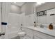 A well-lit bathroom featuring a shower/tub and a vanity with a clean, white aesthetic at 1249 Sika Ln, Greenwood, IN 46143
