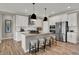 Modern kitchen with white cabinets, stainless steel appliances, and a spacious center island at 1249 Sika Ln, Greenwood, IN 46143