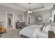 Main bedroom featuring modern lighting, neutral walls, carpet, modern furnishings, and an ensuite bathroom at 1249 Sika Ln, Greenwood, IN 46143