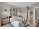 Comfortable main bedroom featuring neutral decor, pendant lighting, and ensuite access at 1249 Sika Ln, Greenwood, IN 46143