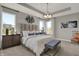 Spacious main bedroom with a tray ceiling, a large upholstered headboard, a chandelier, and lots of natural light at 1249 Sika Ln, Greenwood, IN 46143