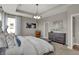 Main bedroom with tray ceilings, carpet, natural light, modern furnishings, and neutral walls at 1249 Sika Ln, Greenwood, IN 46143