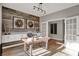 Beautiful home office with custom built-ins, a wood accent wall, and French doors at 1249 Sika Ln, Greenwood, IN 46143