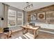 Stylish office space with a modern desk, wood accent wall, and ample natural light at 1249 Sika Ln, Greenwood, IN 46143