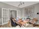 Stylish office space featuring double doors, wood desk, and decorative art piece at 1249 Sika Ln, Greenwood, IN 46143