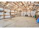 Spacious barn featuring a high ceiling, natural light, and potential for various uses and storage at 1250 W 141St St, Carmel, IN 46032