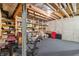 Basement with exposed ceiling and storage shelving, offering a versatile space for various uses at 1250 W 141St St, Carmel, IN 46032