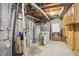 Utility area with water tanks, filtration system, and exposed pipes, wiring, and mechanicals at 1250 W 141St St, Carmel, IN 46032