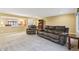 Open basement living area with view to another room and comfortable sofa and recliner seating at 1250 W 141St St, Carmel, IN 46032
