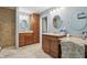 Stylish bathroom with dual vanities, warm-toned tiles, marble countertops, and a walk-in shower at 1250 W 141St St, Carmel, IN 46032