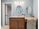 Bright bathroom featuring a vanity with dual mirrors, cabinets, and a marble countertop at 1250 W 141St St, Carmel, IN 46032
