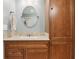 Inviting bathroom featuring a sink, cabinets, and a matching storage cabinet at 1250 W 141St St, Carmel, IN 46032