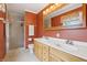 Bathroom featuring double sinks, wood cabinets, and walk-in shower with a sliding glass door at 1250 W 141St St, Carmel, IN 46032