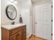Powder room offers granite vanity, decorative mirror, and stylish fixtures at 1250 W 141St St, Carmel, IN 46032