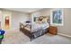 Large bedroom features neutral decor, plush carpet, natural light and a comfortable wrought iron bed at 1250 W 141St St, Carmel, IN 46032