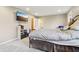 Cozy bedroom featuring a comfortable bed, TV, and storage shelves for organized living at 1250 W 141St St, Carmel, IN 46032