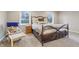 Serene bedroom with a cozy bed, plush pillows, and natural light from the windows at 1250 W 141St St, Carmel, IN 46032