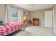 Comfortable bedroom featuring neutral carpet, ceiling fan, ample light, desk and shelving, with cozy decor at 1250 W 141St St, Carmel, IN 46032