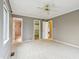 Spacious bedroom with neutral walls, ceiling fan and carpet with a view of closet and bathroom at 1250 W 141St St, Carmel, IN 46032