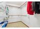 Walk-in closet offering ample storage with shelves and wooden hanging rods for organization at 1250 W 141St St, Carmel, IN 46032