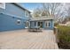 Outdoor deck with a wooden table and chairs, overlooking a big backyard with a view of neighboring properties at 1250 W 141St St, Carmel, IN 46032
