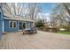 Spacious outdoor deck with a table and chairs, offering an entertainment space with a view of the backyard at 1250 W 141St St, Carmel, IN 46032