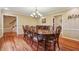 Elegant dining room featuring hardwood floors, chandelier, and ample space for a large dining set, perfect for Gathering gatherings at 1250 W 141St St, Carmel, IN 46032