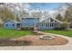 Charming home exterior with a fire pit area, featuring a well-manicured lawn and ample space for outdoor enjoyment at 1250 W 141St St, Carmel, IN 46032