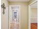 Hallway view highlighting gleaming hardwood floors and neutral paint at 1250 W 141St St, Carmel, IN 46032