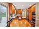 Well-equipped kitchen featuring wood cabinets, modern appliances, and a cozy breakfast nook with views to the yard at 1250 W 141St St, Carmel, IN 46032