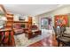 Cozy living room with hardwood floors, fireplace, and built-in bookshelves at 1250 W 141St St, Carmel, IN 46032