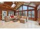 Bright sunroom with sectional couch, vaulted ceiling, and backyard view at 1250 W 141St St, Carmel, IN 46032