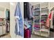 Well-organized walk-in closet providing ample storage with shelves, hangers, and a luggage rack at 1250 W 141St St, Carmel, IN 46032