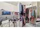 Organized walk-in closet offering ample storage with shelves, drawers, and clothing racks at 1250 W 141St St, Carmel, IN 46032
