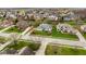 An aerial shot of a home in a beautiful neighborhood featuring mature trees, manicured lawns, and a peaceful residential setting at 12526 Pembrooke Cir, Carmel, IN 46032