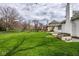 Expansive backyard features a well-maintained lawn, landscaping, and mature trees at 12526 Pembrooke Cir, Carmel, IN 46032