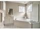 Relaxing bathroom featuring an oversized corner bathtub and ample natural light at 12526 Pembrooke Cir, Carmel, IN 46032