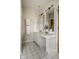 Bathroom featuring a modern vanity with and mirrors and decorative plant at 12526 Pembrooke Cir, Carmel, IN 46032