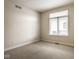 Carpeted bedroom with a large window providing ample natural light at 12526 Pembrooke Cir, Carmel, IN 46032