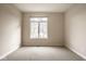 Bright, carpeted bedroom with large window offering natural light at 12526 Pembrooke Cir, Carmel, IN 46032