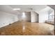 Bonus room featuring hardwood floors, a skylight, and a large window with built-in shelving at 12526 Pembrooke Cir, Carmel, IN 46032