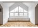 Bonus room featuring hardwood floors and a large window with built-in seating at 12526 Pembrooke Cir, Carmel, IN 46032