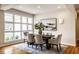 Dining room with hardwood floors, six chairs, and a decorative painting at 12526 Pembrooke Cir, Carmel, IN 46032